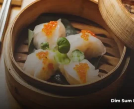 Traditional dim sum dishes including dumplings and buns in a London restaurant