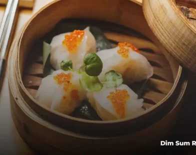 Traditional dim sum dishes including dumplings and buns in a London restaurant