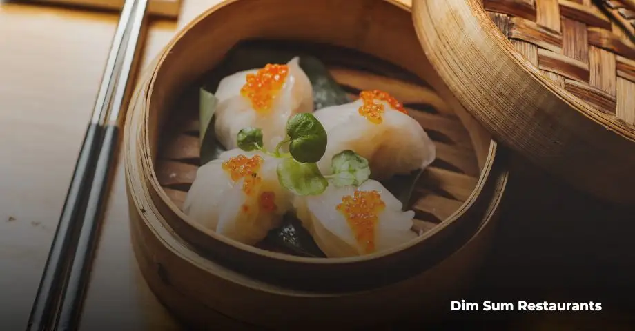 Traditional dim sum dishes including dumplings and buns in a London restaurant