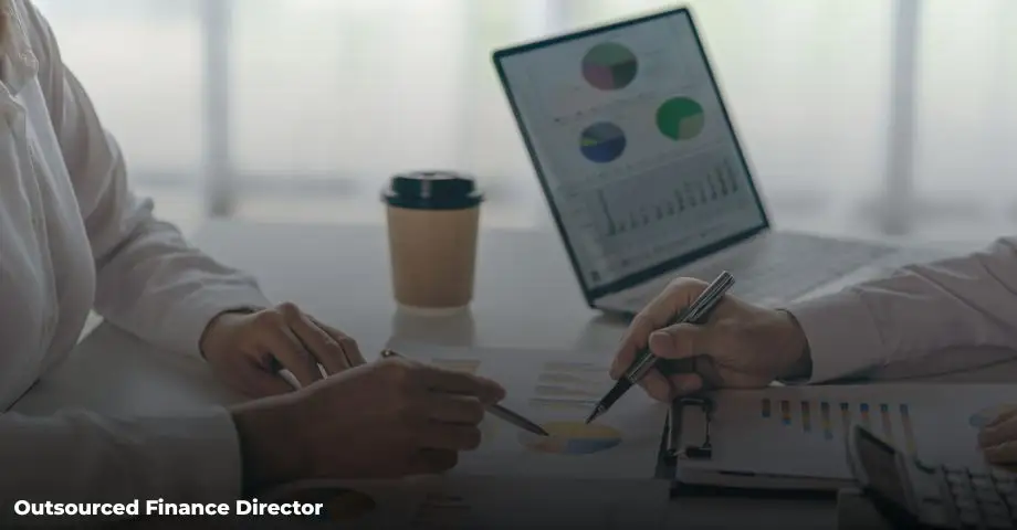 Outsourced finance director analyzing financial reports