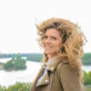 windblown curly hair on a bright day