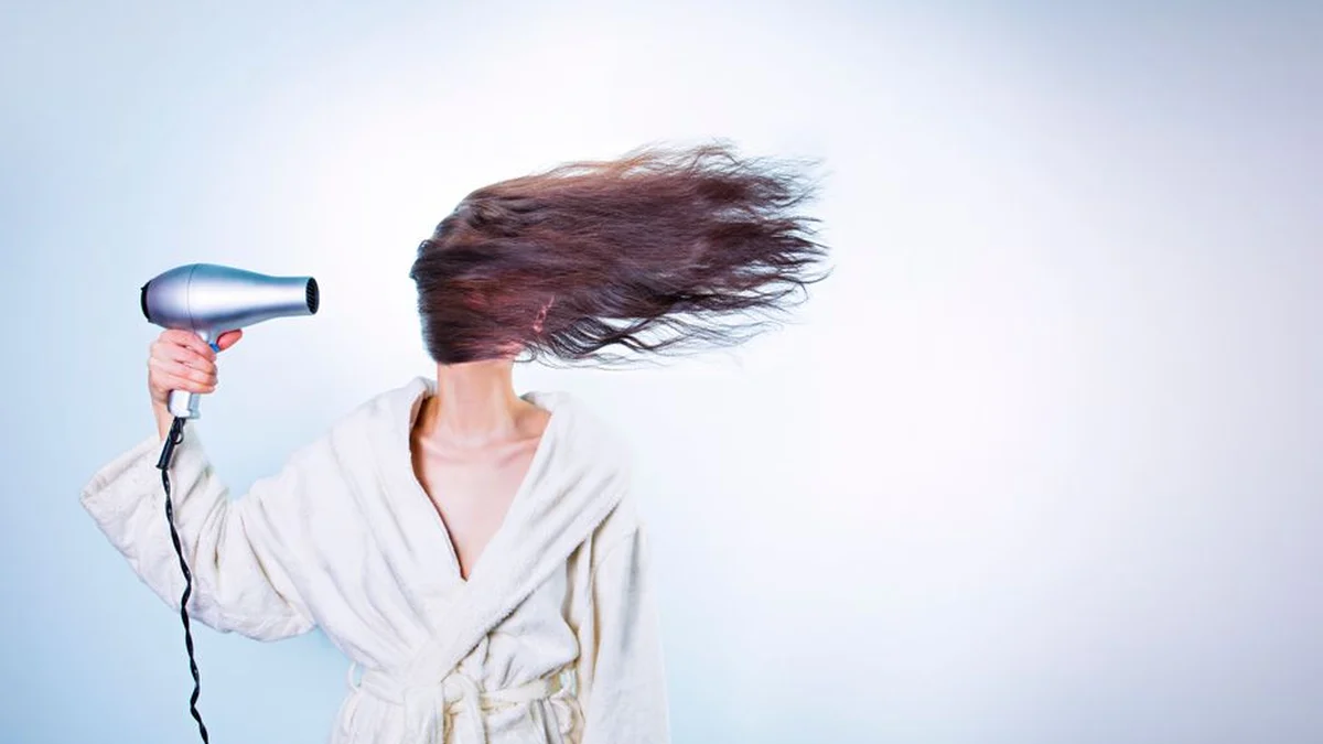drying long hair at home with the hair flying up