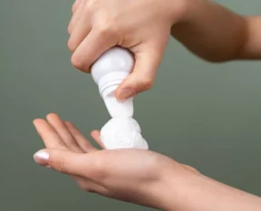 dispensing hair mousse into an open palm