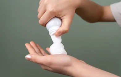 dispensing hair mousse into an open palm