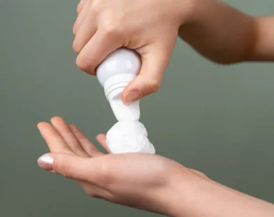 dispensing hair mousse into an open palm