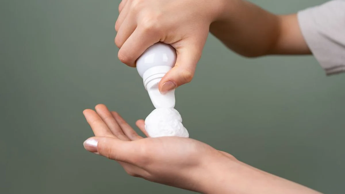 dispensing hair mousse into an open palm