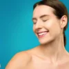 woman holding a clear spray bottle for her hair