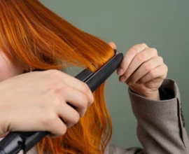 using a flat iron on long red hair