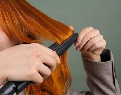 using a flat iron on long red hair