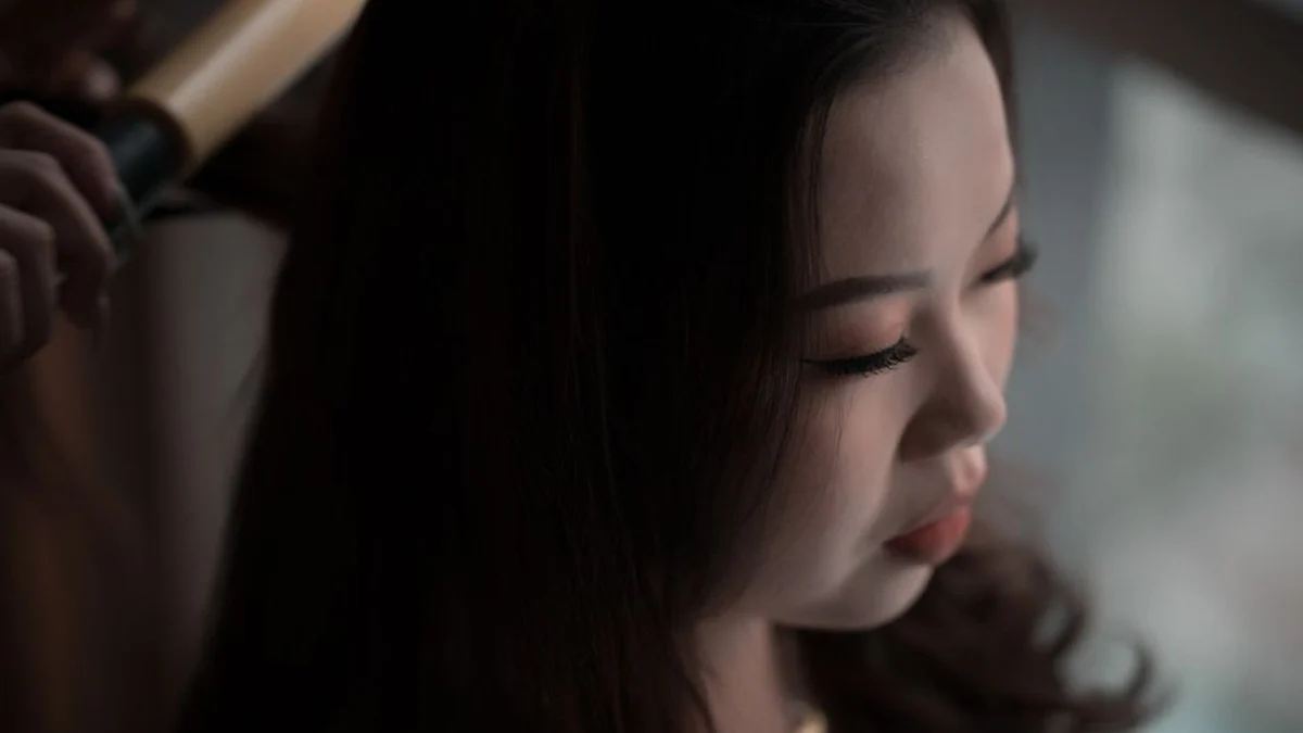 close-up of hair being styled with a curling iron