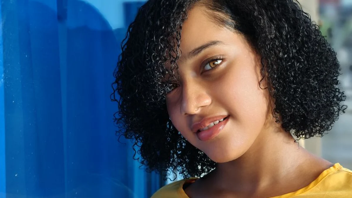 woman with defined curls after the cast has been scrunched out