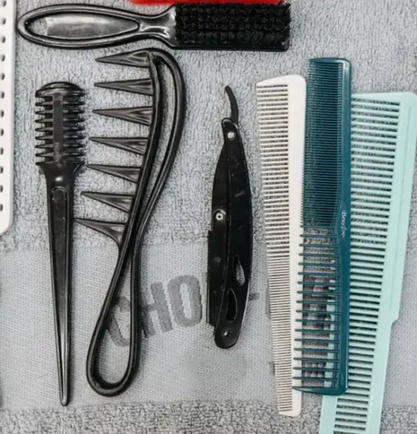 a flat lay of combs, brushes, scissors and styling tools