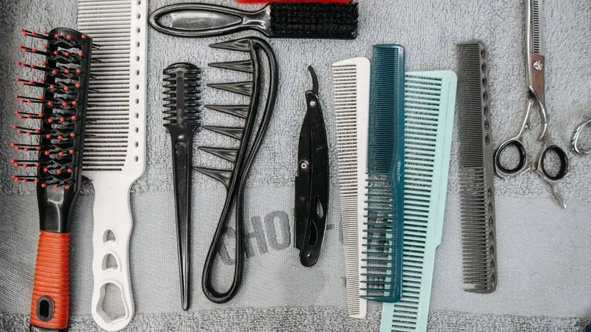 a flat lay of combs, brushes, scissors and styling tools