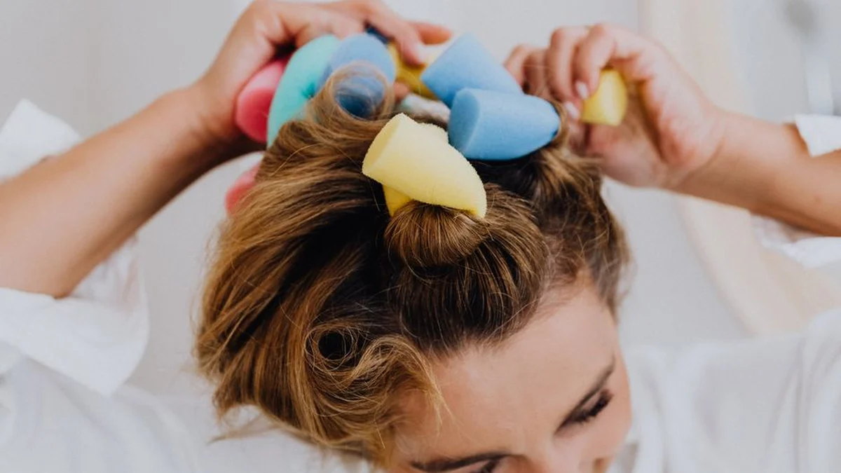 putting foam rollers into damp hair